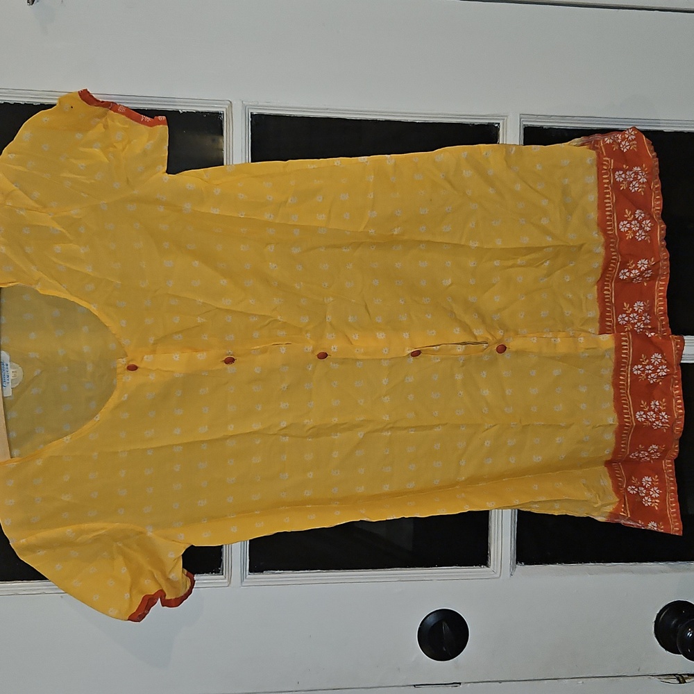 Vibrant Yellow Top With White And Orange Accents